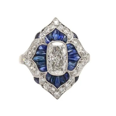 Platinum Cushion Cut Diamond Ring with Sapphire Accents
