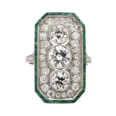 Platinum Ring with Diamonds and Emerald Accents