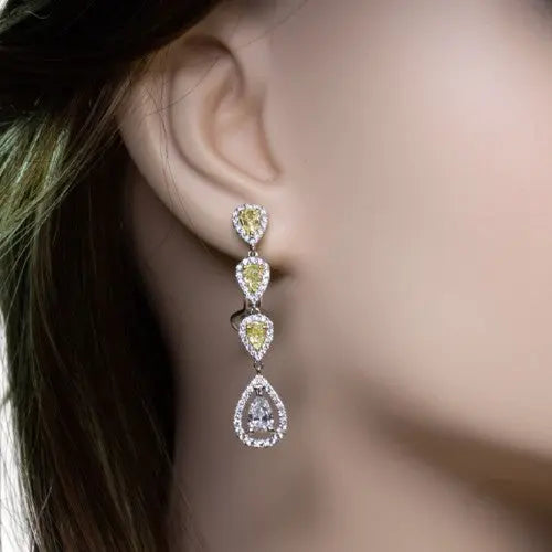 18K Gold Diamond Earrings with Round and Pear Cuts