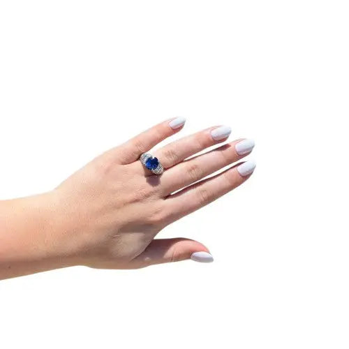 5.08ct Oval Sapphire Ring with 1.00ctw Round Brilliant and Princess Cut Diamonds