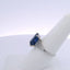 6.06CTW EMERALD CUT SAPPHIRE & 0.35CTW BAGUETTE CUT DIAMOND RING