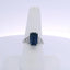 6.06CTW EMERALD CUT SAPPHIRE & 0.35CTW BAGUETTE CUT DIAMOND RING