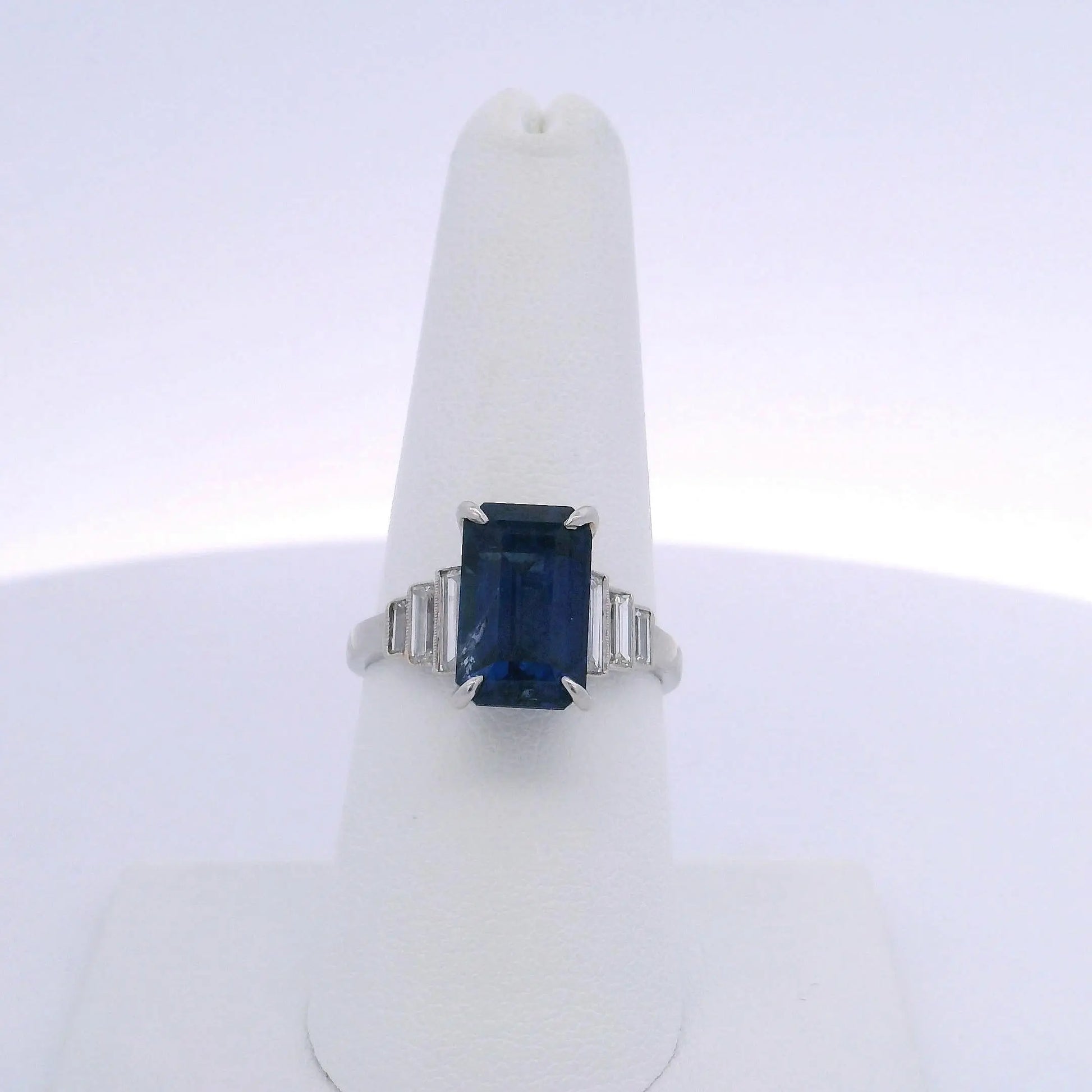 6.06CTW EMERALD CUT SAPPHIRE & 0.35CTW BAGUETTE CUT DIAMOND RING