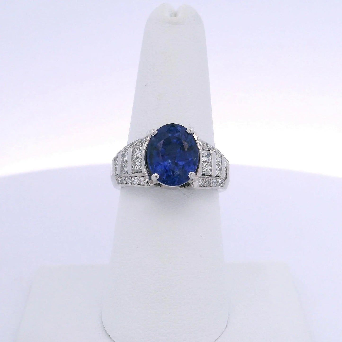 5.08CTW OVAL CUT SAPPHIRE 1.00CTW PRINCESS & ROUND BRILLIANT CUT DIAMOND RING