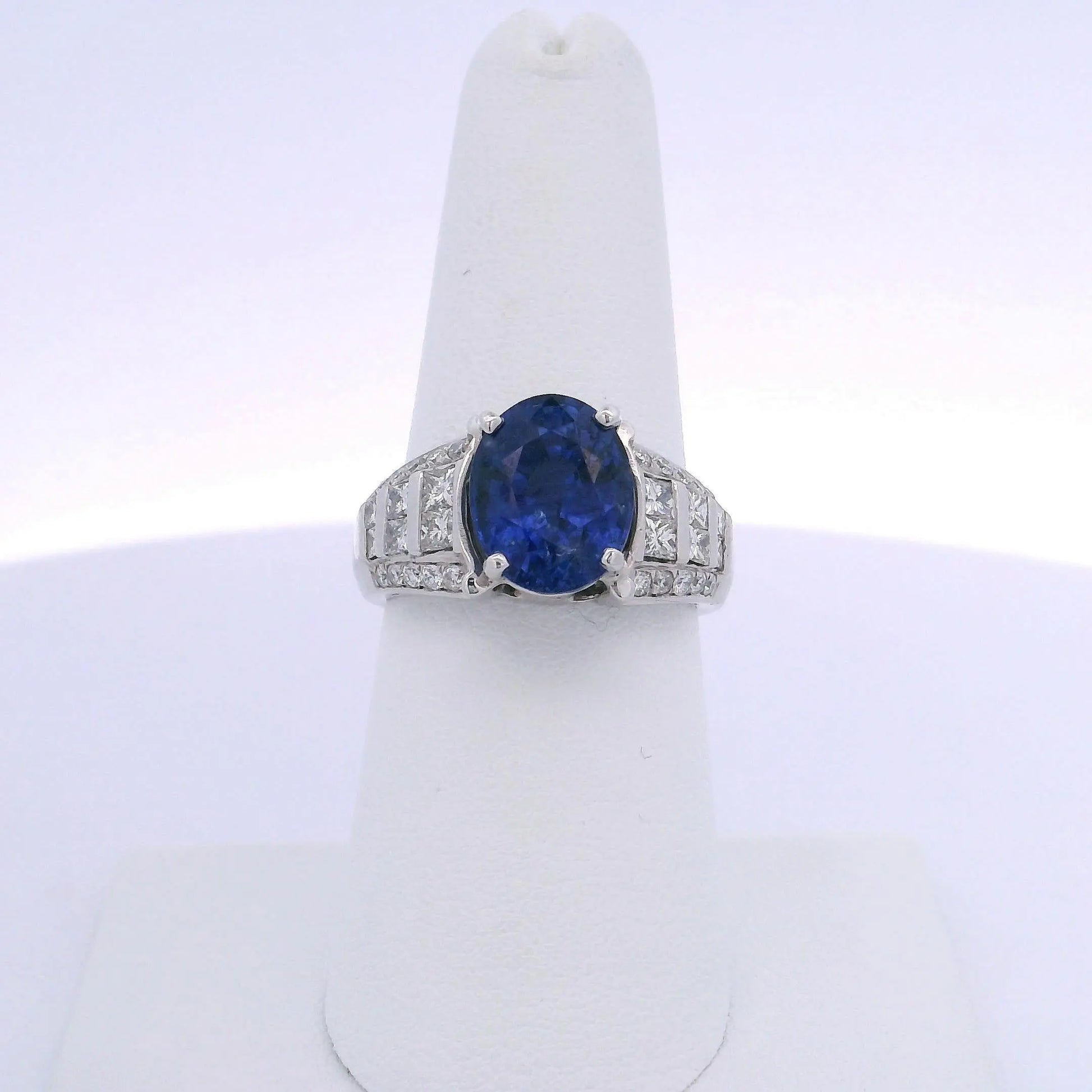 5.08CTW OVAL CUT SAPPHIRE 1.00CTW PRINCESS & ROUND BRILLIANT CUT DIAMOND RING