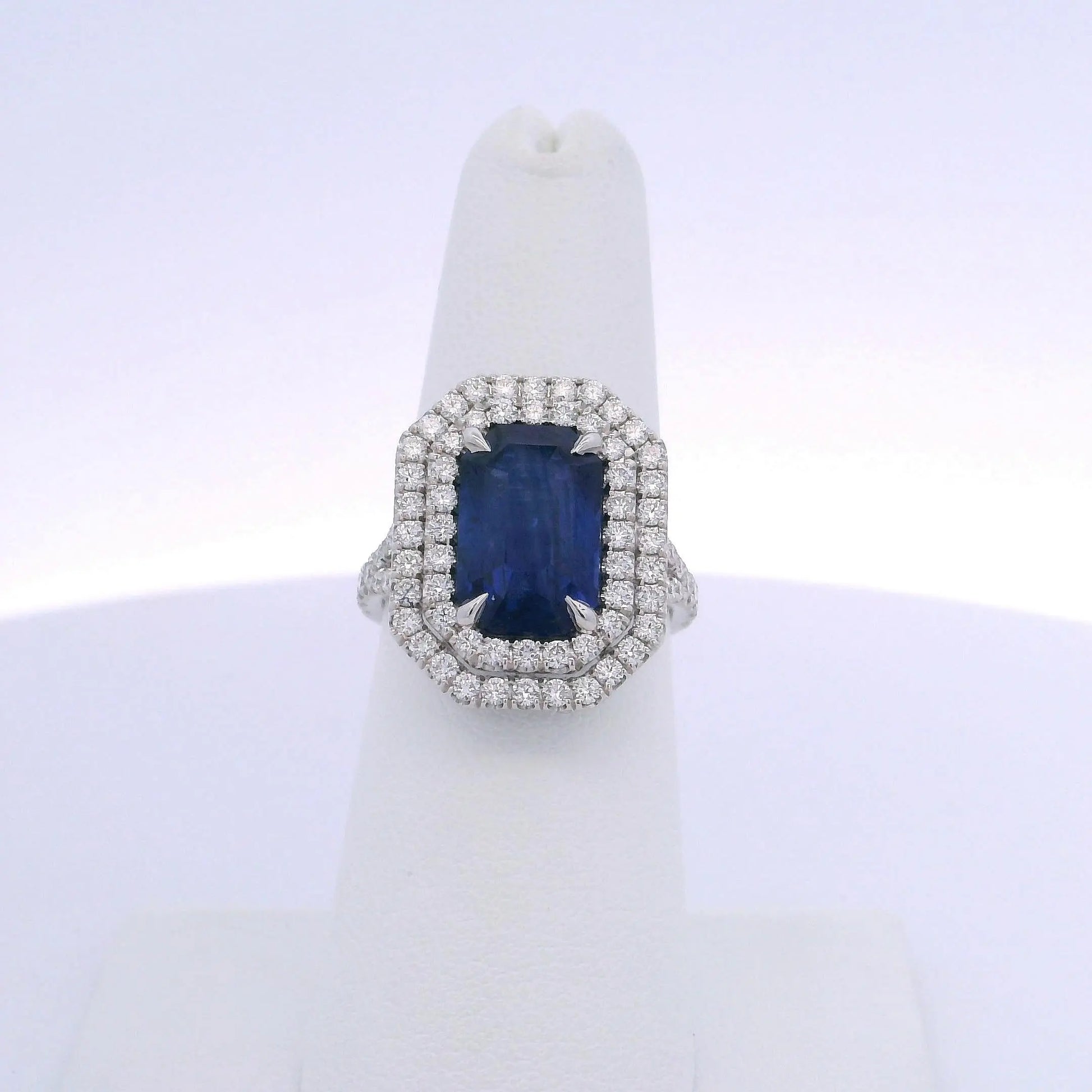 5.28CTW EMERALD CUT SAPPHIRE & 1.12CTW DIAMOND RING