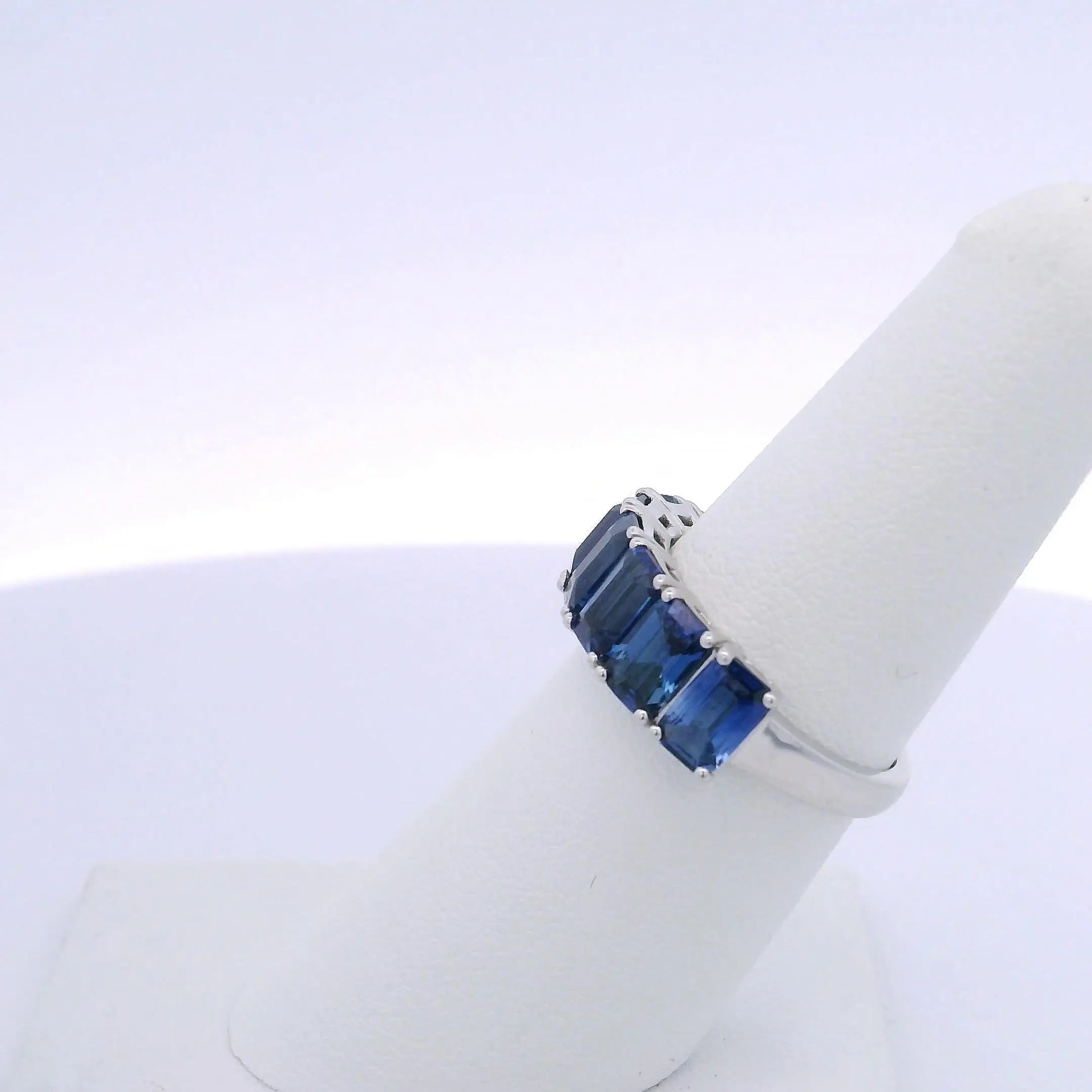 4.25CTW EMERALD CUT SAPPHIRE 7 STONE RING