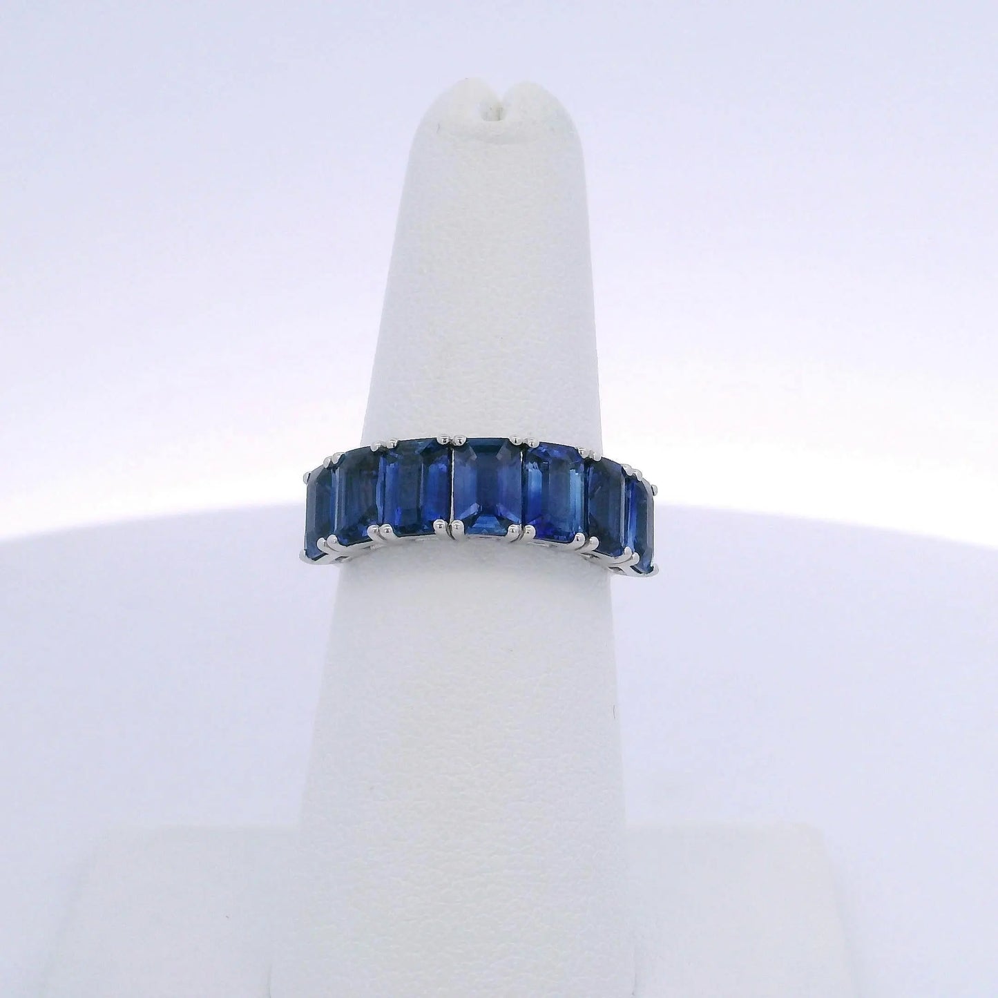 4.25CTW EMERALD CUT SAPPHIRE 7 STONE RING