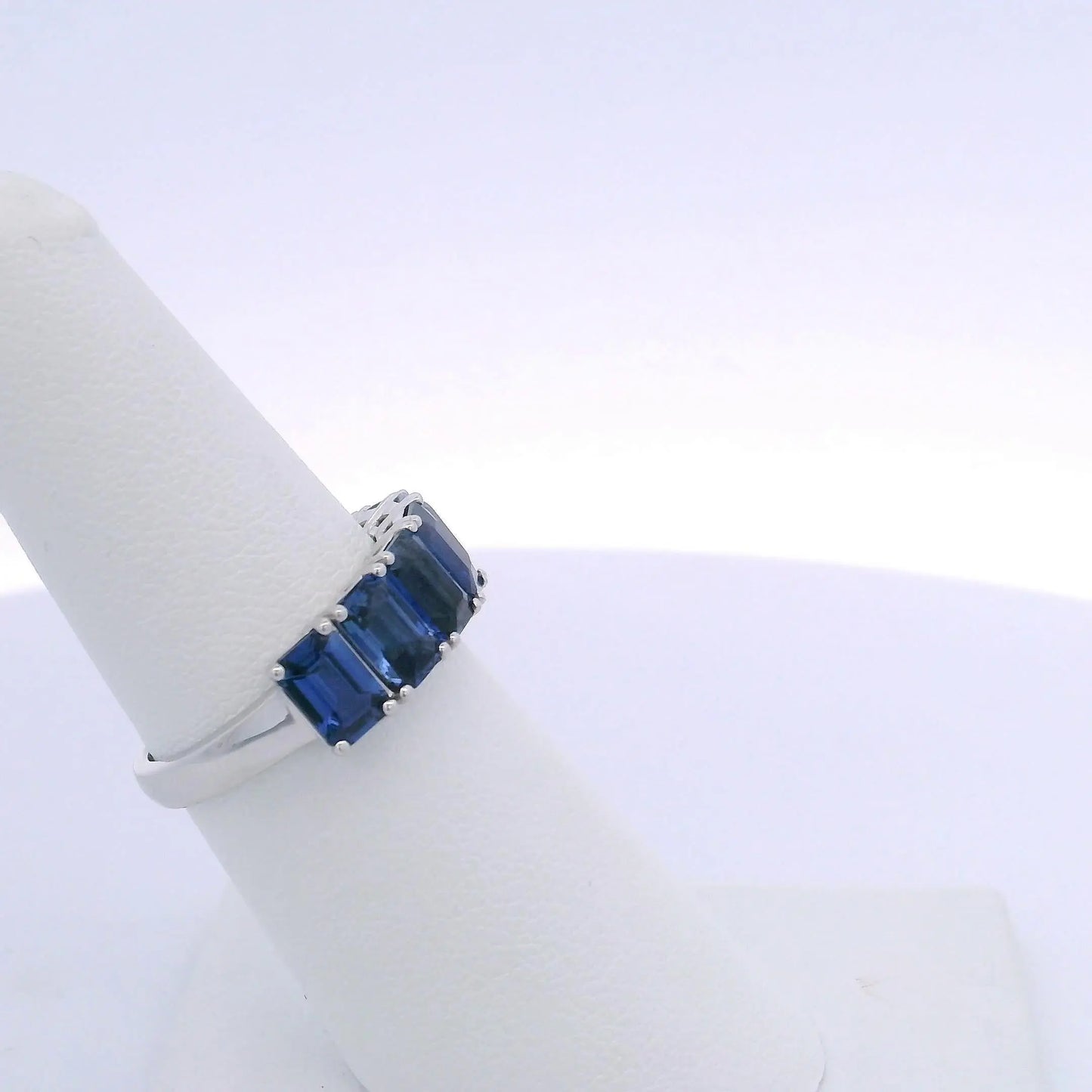 4.25CTW EMERALD CUT SAPPHIRE 7 STONE RING