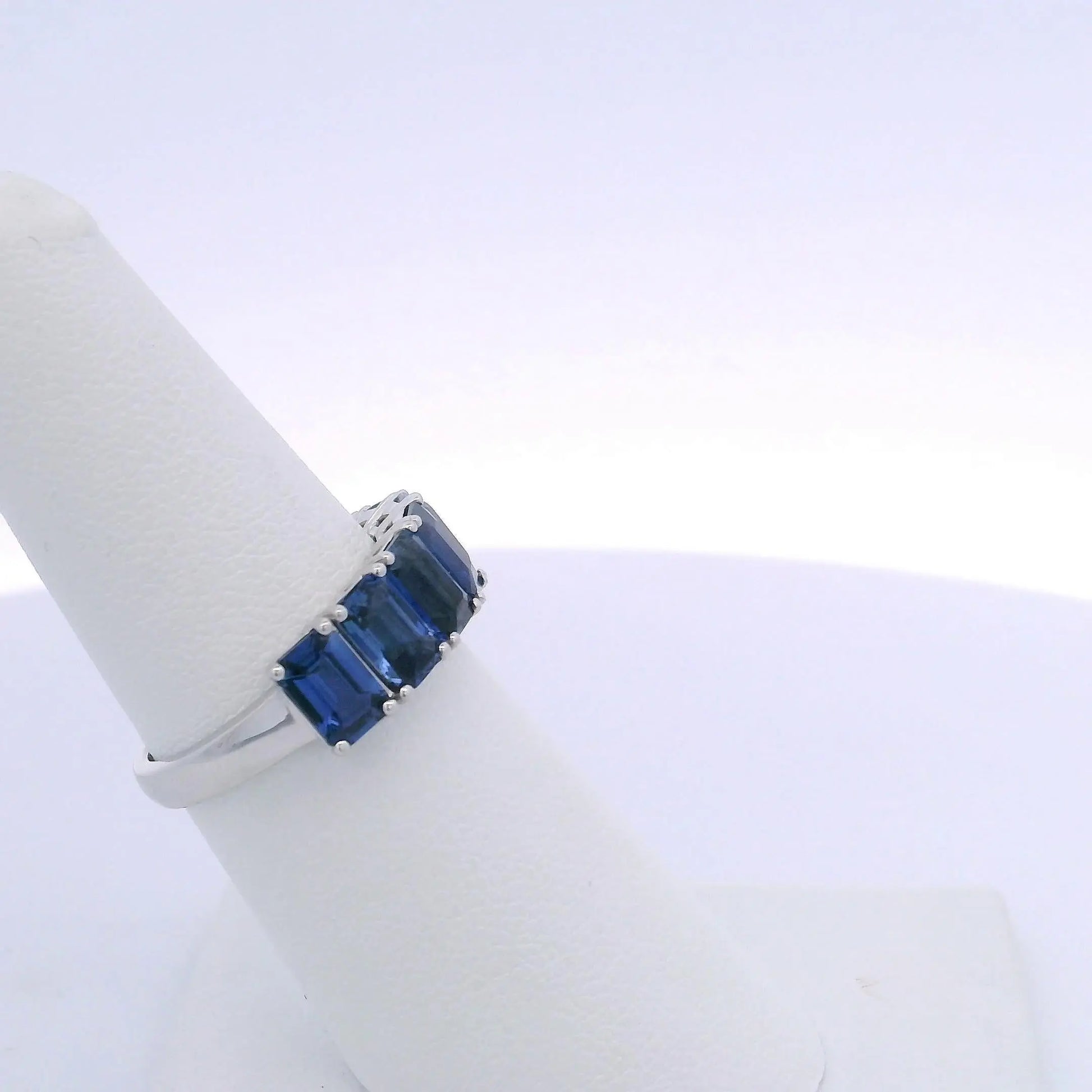 4.25CTW EMERALD CUT SAPPHIRE 7 STONE RING