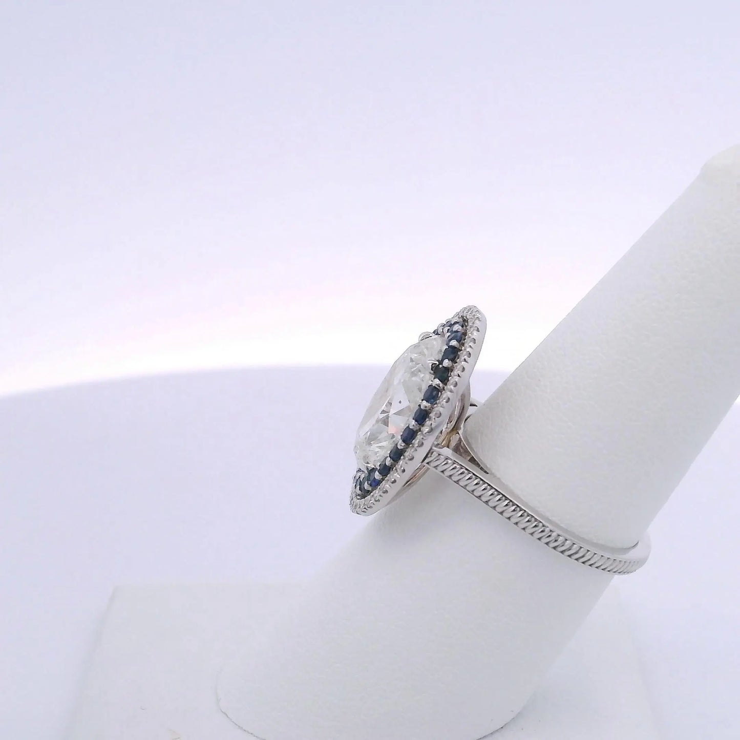 5.01CTW OVAL DIAMOND CUT & 0.63CTW SAPPHIRE RING