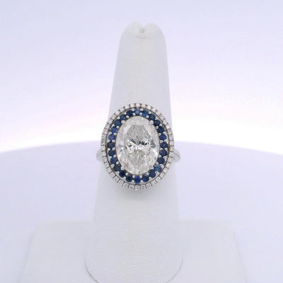5.01CTW OVAL DIAMOND CUT & 0.63CTW SAPPHIRE RING