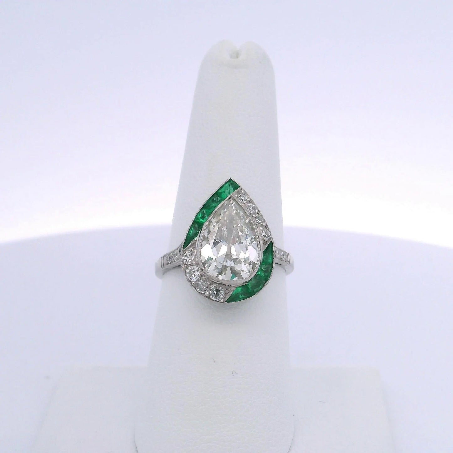 2.80CT ANTIQUE PEAR SHAPED DIAMOND & 1.40CTW EMERALD RING