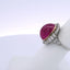 15.25CT OVAL RUBY & 0.75CTW ROUND BRILLIANT CUT DIAMOND RING