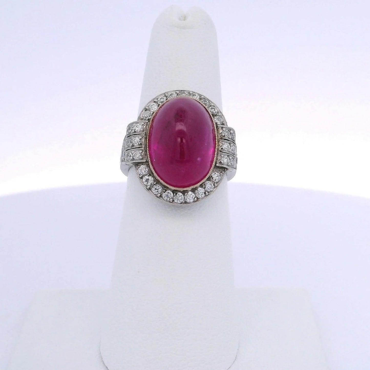 15.25CT OVAL RUBY & 0.75CTW ROUND BRILLIANT CUT DIAMOND RING