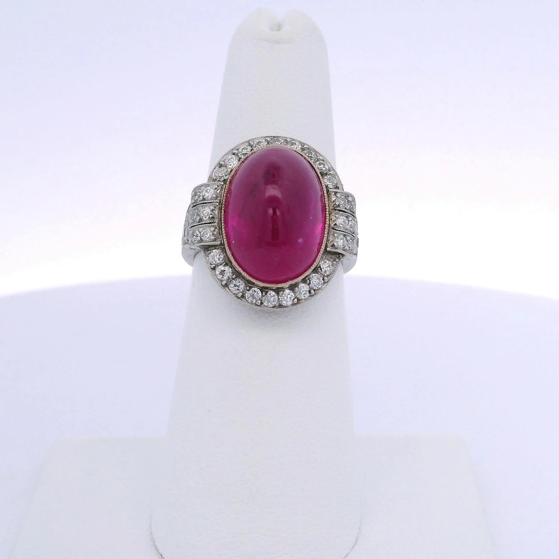 15.25CT OVAL RUBY & 0.75CTW ROUND BRILLIANT CUT DIAMOND RING