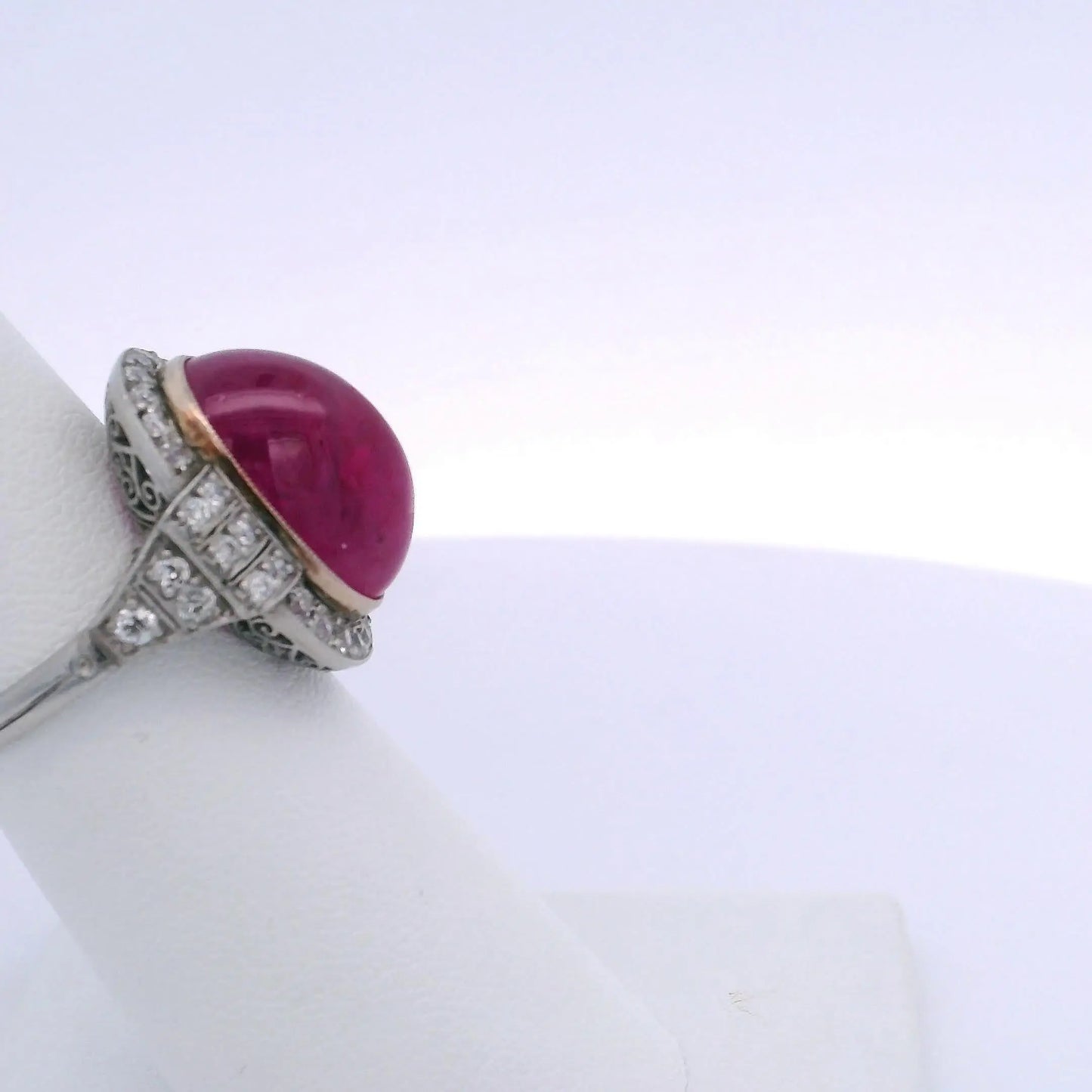 15.25CT OVAL RUBY & 0.75CTW ROUND BRILLIANT CUT DIAMOND RING