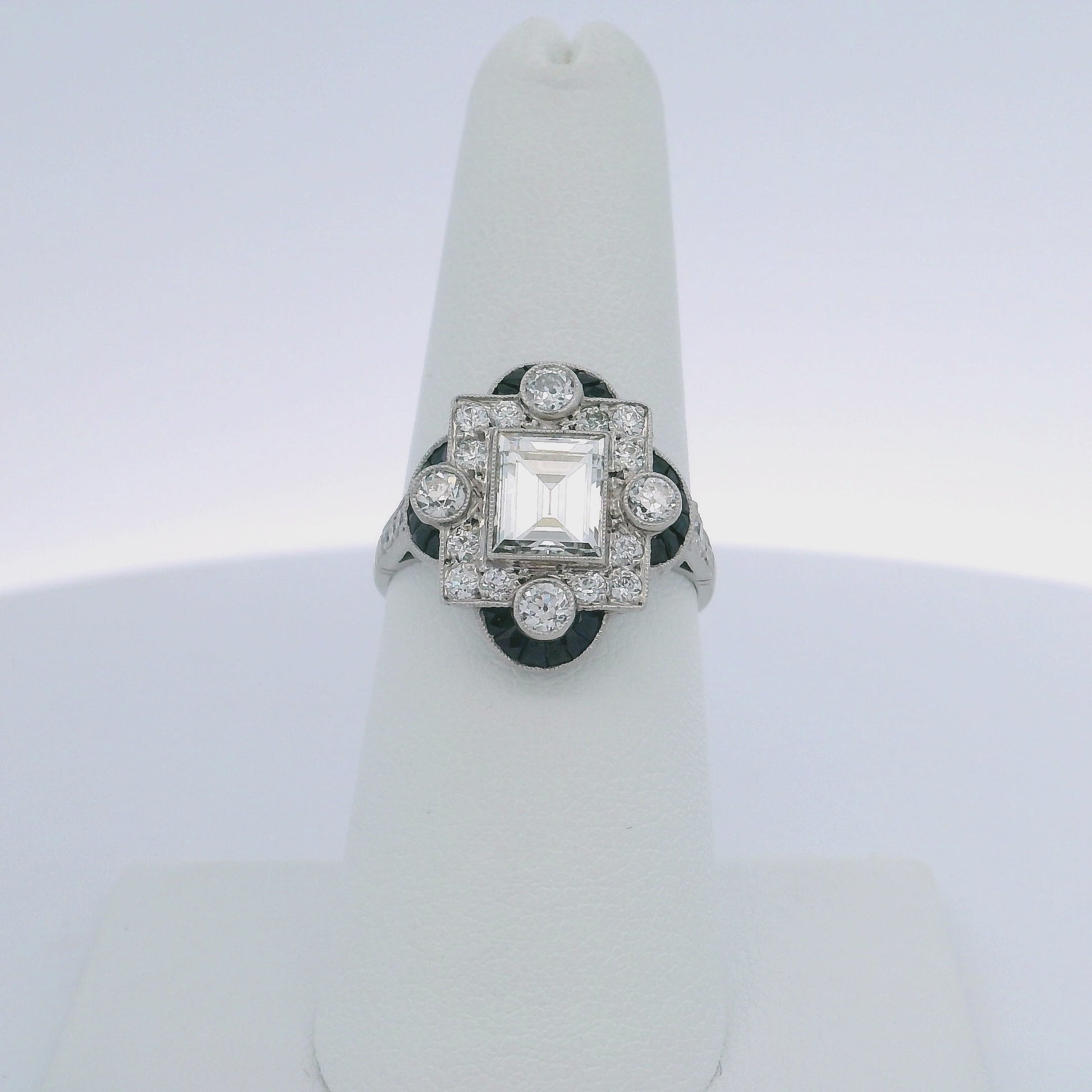 1.30CTW STEP CUT DIAMOND & 0.60CTW SAPPHIRE RING