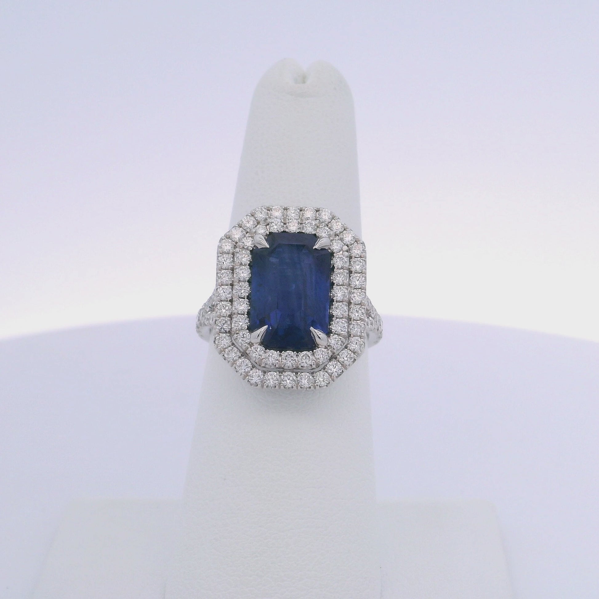 5.28CTW EMERALD CUT SAPPHIRE & 1.12CTW DIAMOND RING