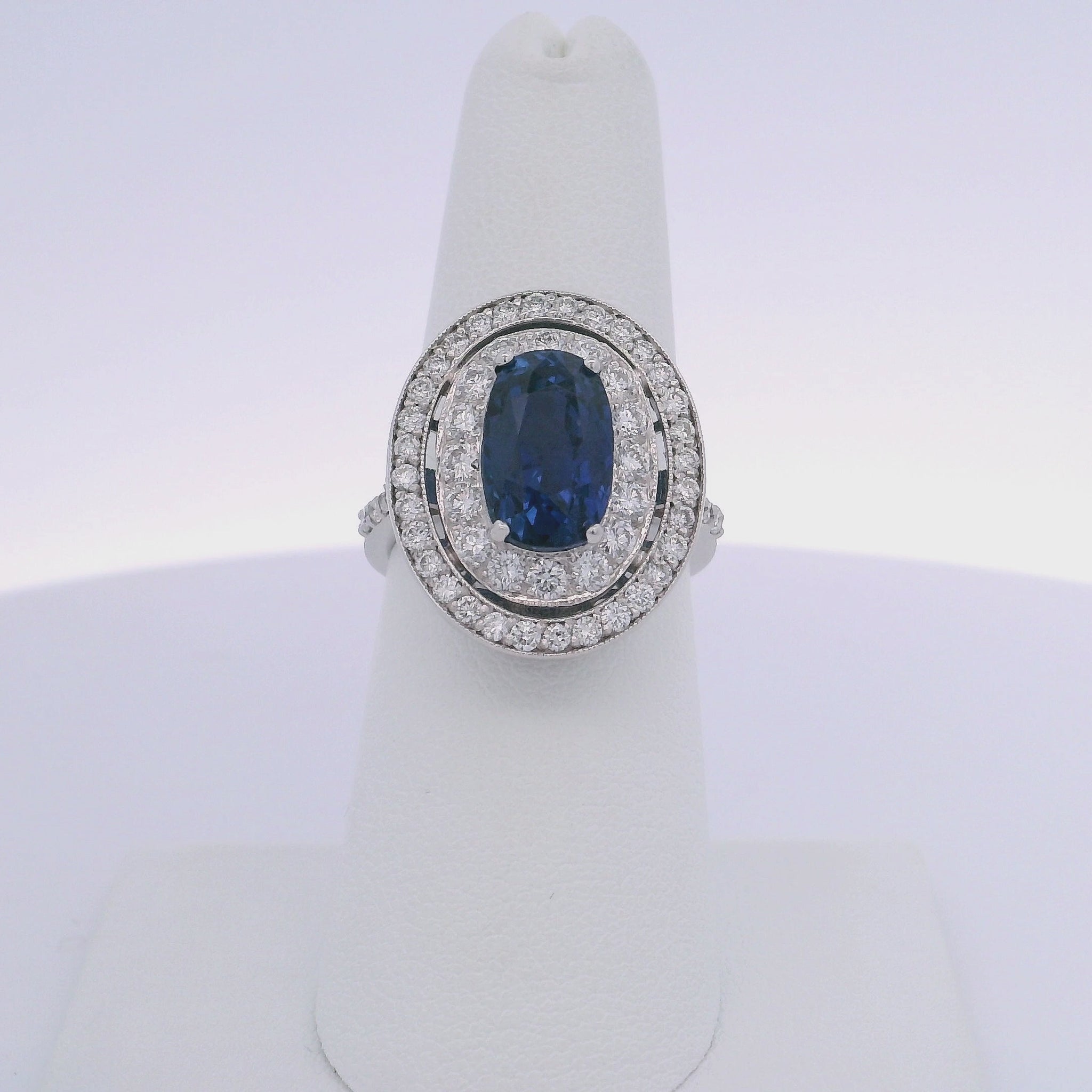 6.63CTW OVAL SAPPHIRE & 0.94CTW ROUND BRILLIANT CUT DIAMOND RING