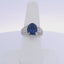 5.08CTW OVAL CUT SAPPHIRE 1.00CTW PRINCESS & ROUND BRILLIANT CUT DIAMOND RING