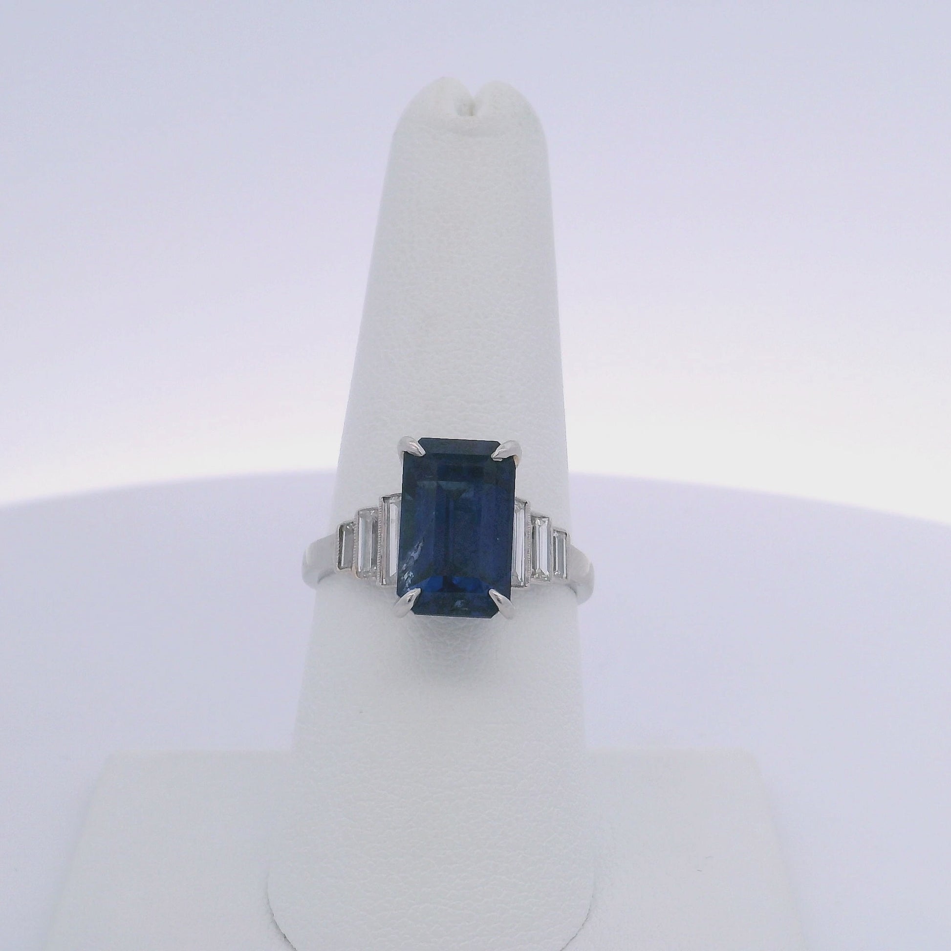 6.06CTW EMERALD CUT SAPPHIRE & 0.35CTW BAGUETTE CUT DIAMOND RING