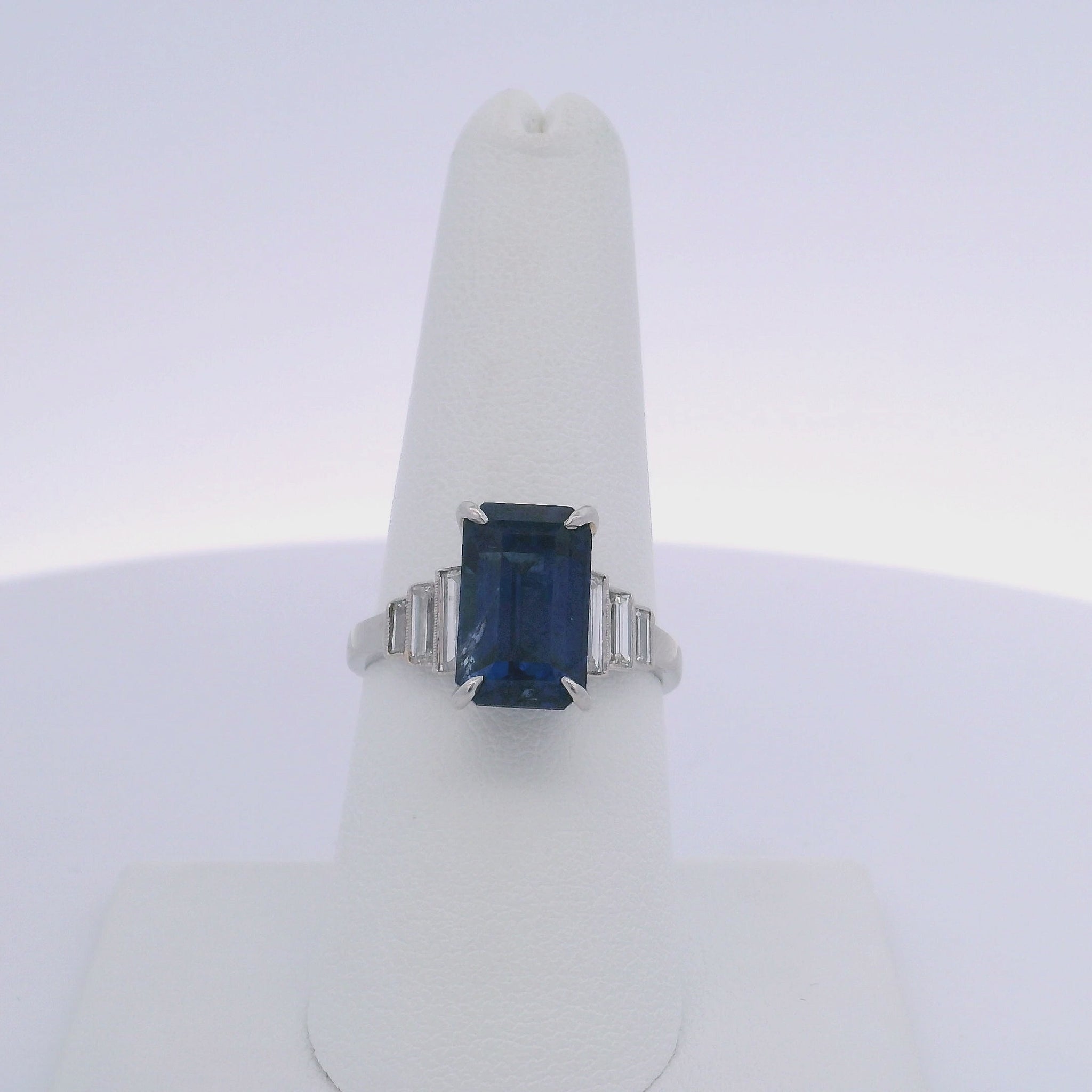 6.06CTW EMERALD CUT SAPPHIRE & 0.35CTW BAGUETTE CUT DIAMOND RING